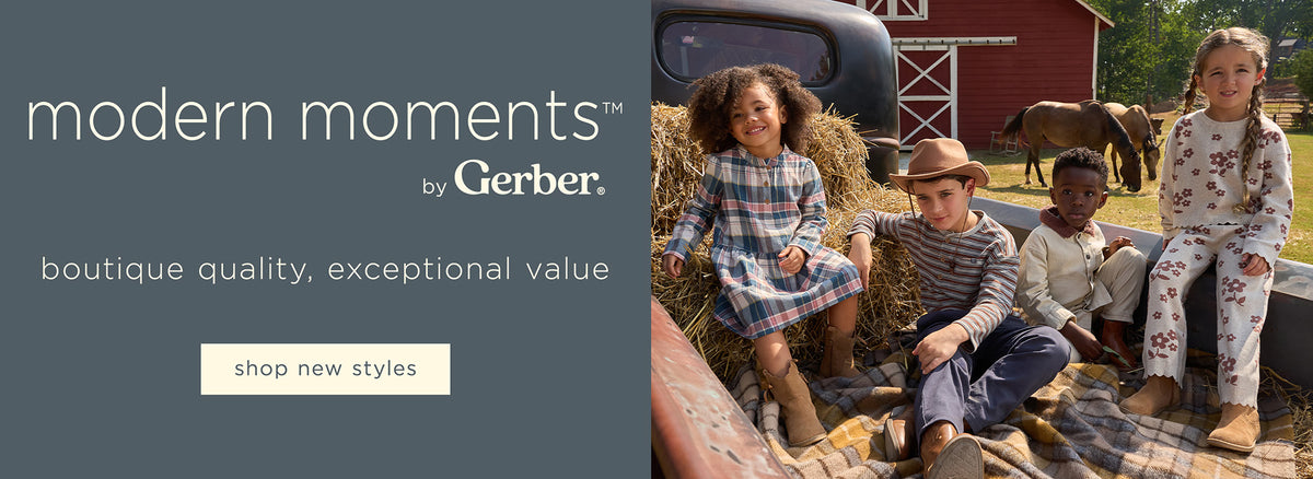 Advertisement for 'modern moments' by Gerber with children in a barn setting.