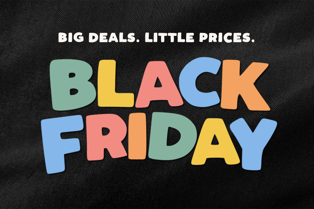 A close-up of a black textured fabric surface with colorful text reading 'BIG DEALS. LITTLE PRICES.
