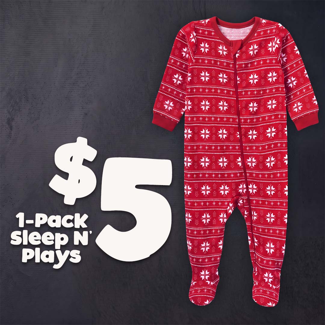 A red footed sleeper with a white Nordic snowflake pattern, displayed on a dark textured background next to a large white '$5' and text reading '1-Pack Sleep N' Plays'.