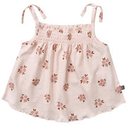 Pink floral dress with thin straps on a white background